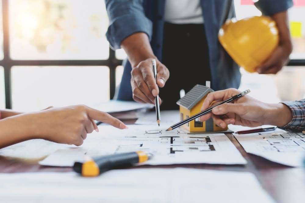 A contractor consulting with a client about building an ADU.